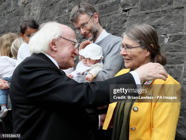 President of Ireland Michael D Higgins greets Micheline Sheehy, the granddaughter of suffragette Hanna Sheehy Skeffington, at the unveiling of the...