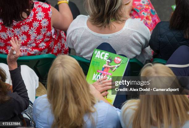 Spectator holds a programme during day 3 of the Nature Valley Open Tennis Tournament at Nottingham Tennis Centre on June 13, 2018 in Nottingham,...