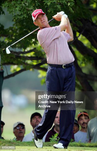 Davis Love III watches his tee shot on the 12th hole during first round play in the 87th PGA Championship at Baltusrol Golf Club in Springfield, N.J.