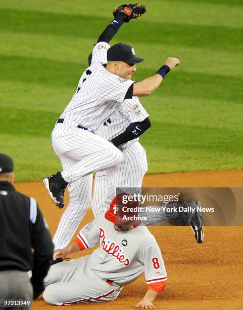 New York Yankees shortstop Derek Jeter turns a double play in the first inning of World Series Game 6 vs. The Philadelphia Phillies at Yankee Stadium.