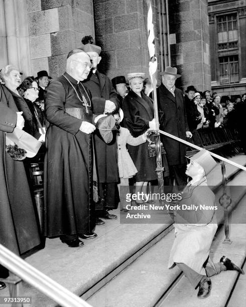 Ten-year-old John McNulty, snaps a picture of Cardinal Spellman on steps of St. Patrick's Cathedral, where the Cardinal reviewed the St. Patrick's...