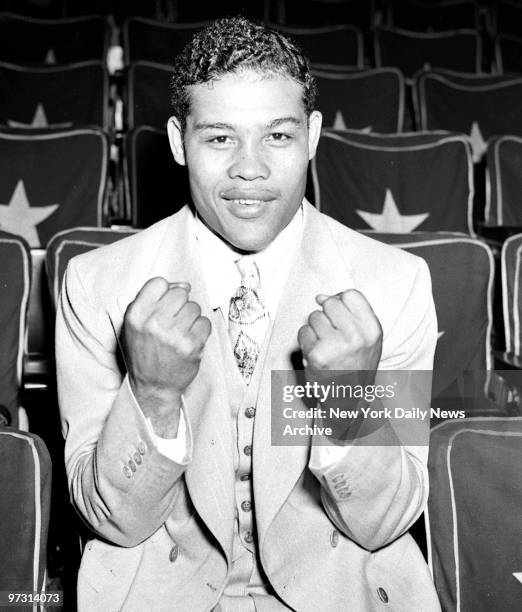 Day after Joe Louis versus Max Schmeling II fight., Joe showing his fists.