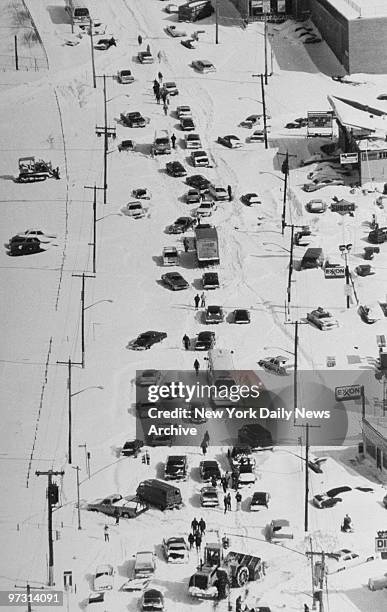 Traffic comes to a standstill after a huge snowfall from a blizzard disabled vehicles around the city.