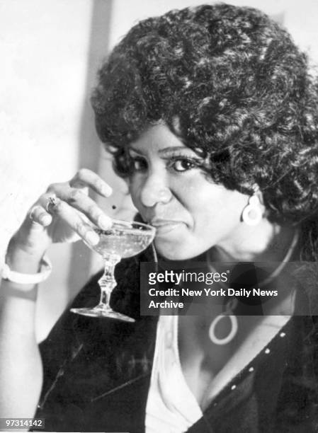 Gloria Gaynor sips champagne in her midtown apartment.