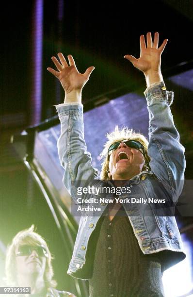 Jon Bon Jovi and lead guitarist Richie Sambora perform at Giants Stadium during Bon Jovi's One Wild Night tour.