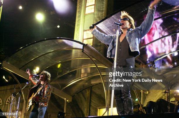 Jon Bon Jovi and lead guitarist Richie Sambora perform at Giants Stadium during Bon Jovi's One Wild Night tour.