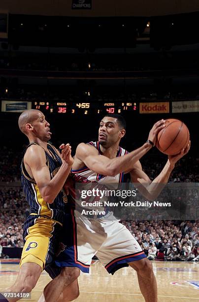 New York Knicks' Allan Houston tries to shake off Reggie Miller of the Indiana Pacers, during Game 6 of the Eastern Conference finals at Madison...