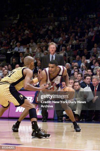 New York Knicks' Allan Houston tries to work his way around Indiana Pacers' Reggie Miller in Game 6 of the Eastern Conference Finals at Madison...