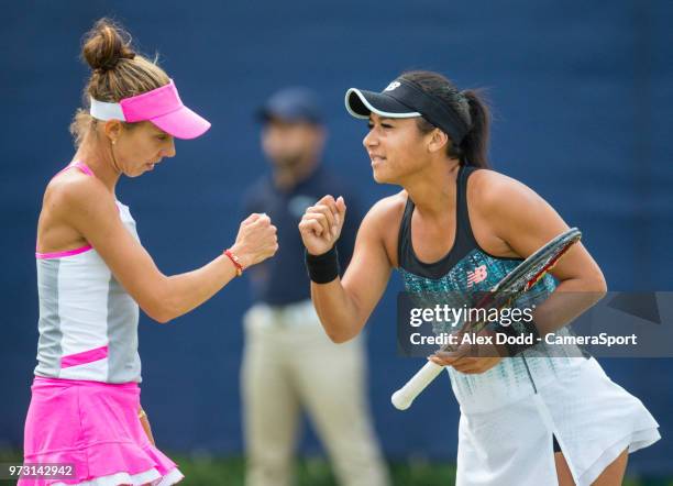 Heather Watson shares a word with her partner Mihaela Buzarnescu during day 3 of the Nature Valley Open Tennis Tournament at Nottingham Tennis Centre...