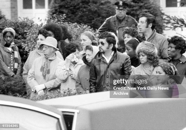 Tragedy seems to have frozen spectators outside St. Martin of Tours Catholic Church in Amityville, L.I., during Mass for Ronald DeFeo, his wife,...