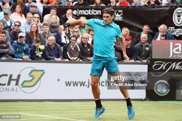 Roger Federer of Switzerland plays a backhand to Mischa Zverev of Germany during day 3 of the Mercedes Cup at Tennisclub Weissenhof on June 13, 2018...