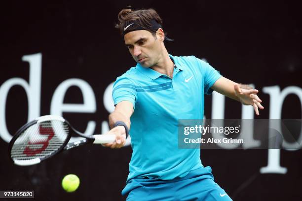 Roger Federer of Switzerland plays a forehand to Mischa Zverev of Germany during day 3 of the Mercedes Cup at Tennisclub Weissenhof on June 13, 2018...