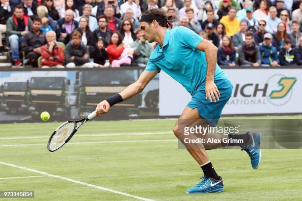 Roger Federer of Switzerland plays a forehand to Mischa Zverev of Germany during day 3 of the Mercedes Cup at Tennisclub Weissenhof on June 13, 2018...