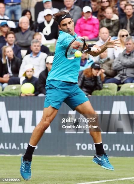 Roger Federer of Switzerland plays a forehand to Mischa Zverev of Germany during day 3 of the Mercedes Cup at Tennisclub Weissenhof on June 13, 2018...