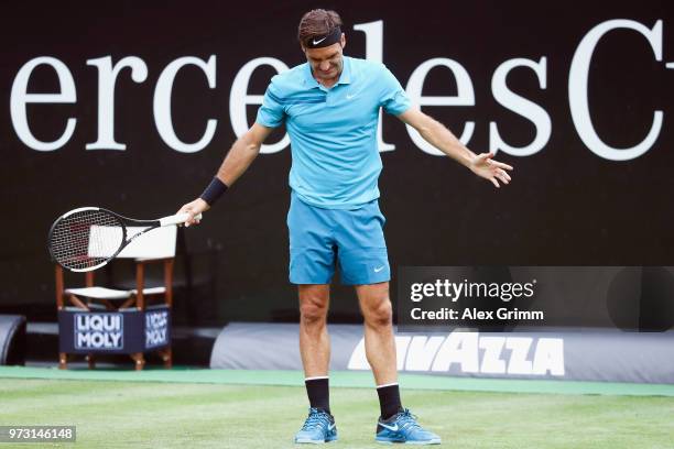 Roger Federer of Switzerland reacts during his match against Mischa Zverev of Germany during day 3 of the Mercedes Cup at Tennisclub Weissenhof on...