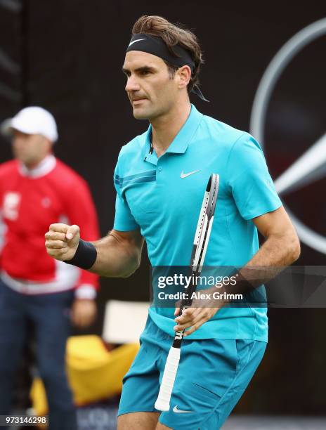 Roger Federer of Switzerland celebrates during his match against during day 3 of the Mercedes Cup at Tennisclub Weissenhof on June 13, 2018 in...