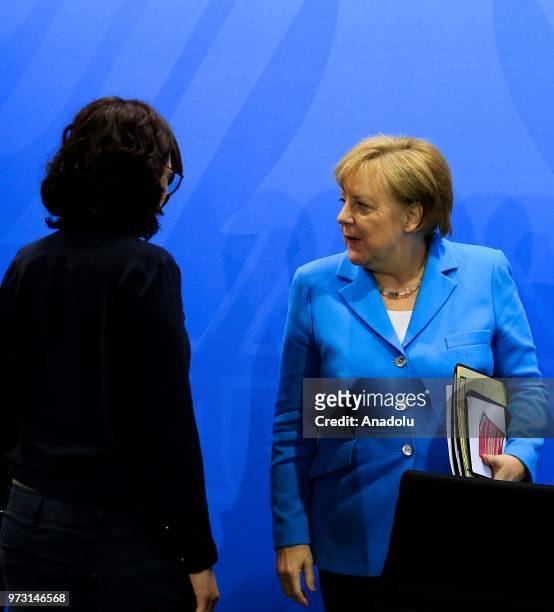 German Chancellor Angela Merkel , and Spokeswoman of the New German Organizations, Ferda Ataman leave after attending a joint press conference...