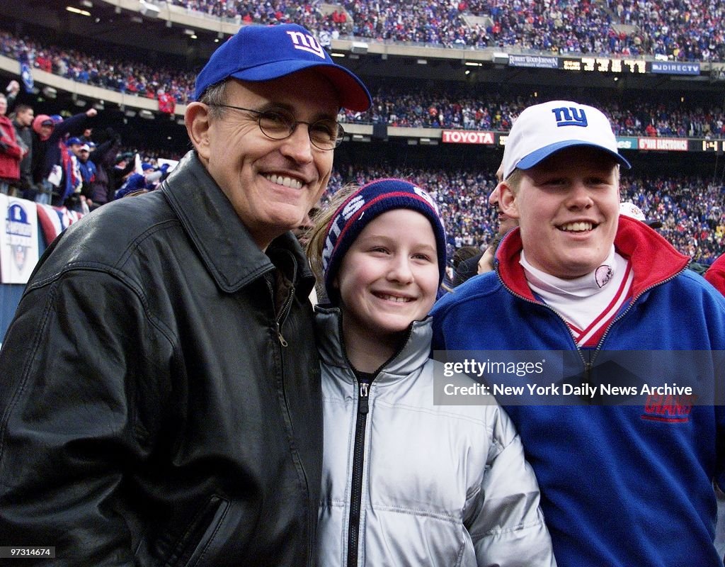 Mayor Rudy Giuliani is on hand with daughter Caroline and so