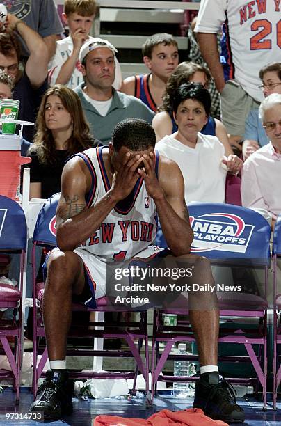 New York Knicks' Chris Childs holds his head in anguish over loss to the Indiana Pacers in Game 6 of the Eastern Conference finals at Madison Square...