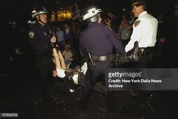Demonstrator is arrested during protest of hate killing of gay student Matthew Shepard.