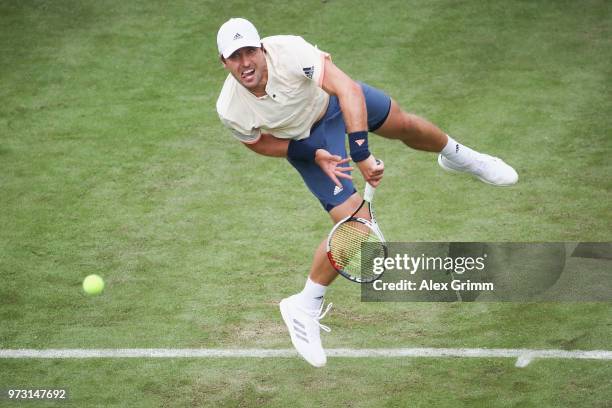 Mischa Zverev of Germany serves the ball to Roger Federer of Switzerland during day 3 of the Mercedes Cup at Tennisclub Weissenhof on June 13, 2018...