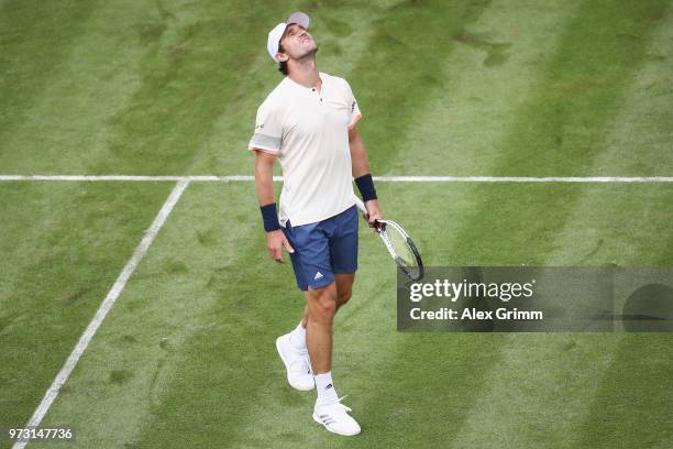Mischa Zverev of Germany reacts during his match against Roger Federer of Switzerland during day 3 of the Mercedes Cup at Tennisclub Weissenhof on...