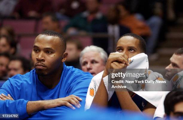 New York Knicks' Clarence Weatherspoon and Howard Eisley sulk on the bench as preseason game against the New Jersey Nets at Continental Airlines...