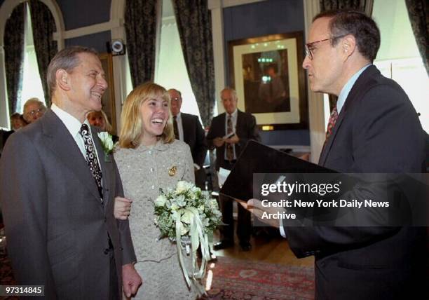 Mayor Rudy Giuliani performs the ceremony as Tony Randall marries Heather Harlan at City Hall.