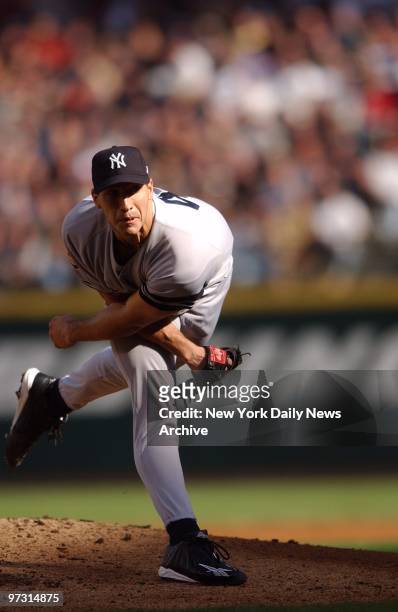 New York Yankees' starter Andy Pettitte delivers a pitch during Game 1 of the American League Championship Series against the Seattle Mariners at...