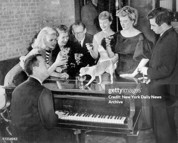 Goldie Hawkins, Jayne Mansfield, Elaine Stritch and friends enjoying entertaining themselves around the piano.