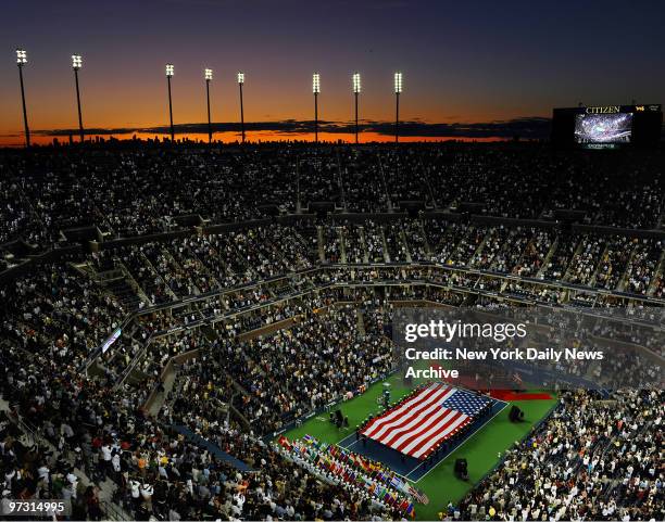 Stadium at sunset with the U.S. Flag at the U.S. Open in Flushing Meadows