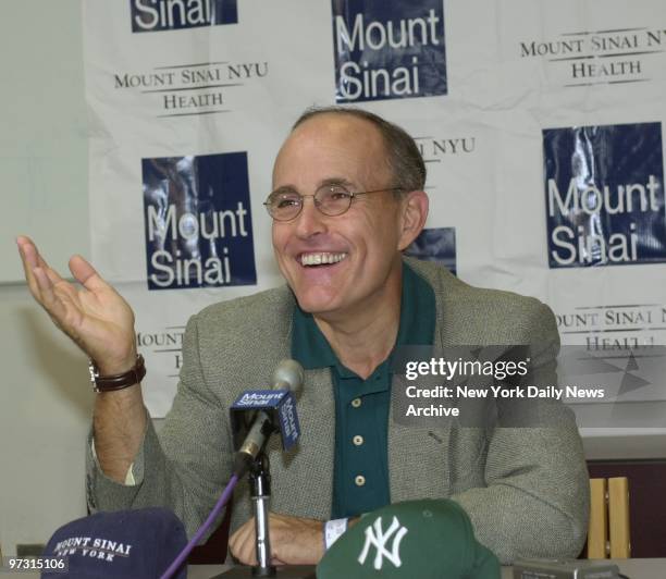 Mayor Rudy Giuliani speaks to the media at Mount Sinai Hospital after receiving radioactive seed implants to combat his prostate cancer.