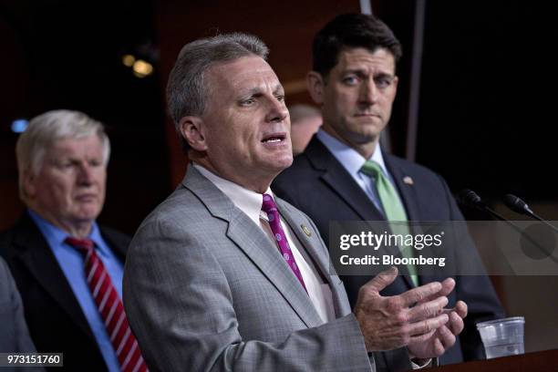 Representative Buddy Carter, a Republican from Georgia, speaks as U.S. House Speaker Paul Ryan, a Republican from Wisconsin, right, listens during a...