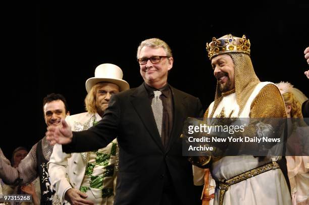 Director Mike Nichols takes the stage with Hank Azaria, David Hyde Pierce and Tim Curry during the curtain call on opening night of the new Broadway...