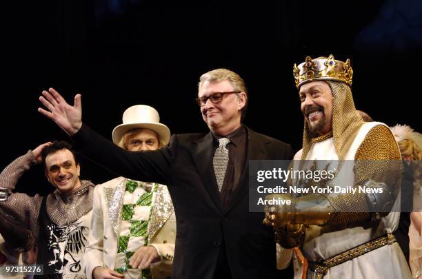 Director Mike Nichols takes the stage with Hank Azaria, David Hyde Pierce and Tim Curry during the curtain call on opening night of the new Broadway...