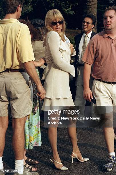 Goldie Hawn has her outfit adjusted at filming of the movie "Town and Country" in Central Park.