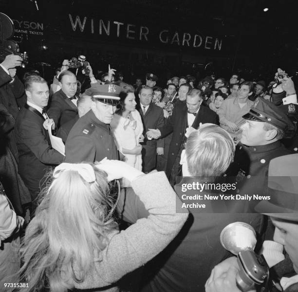 Standing Room Only. Crush of crowd in Times Square threatens Sophia Loren as she arrives for premiere of "Doctor Zhivago," a movie in which she does...