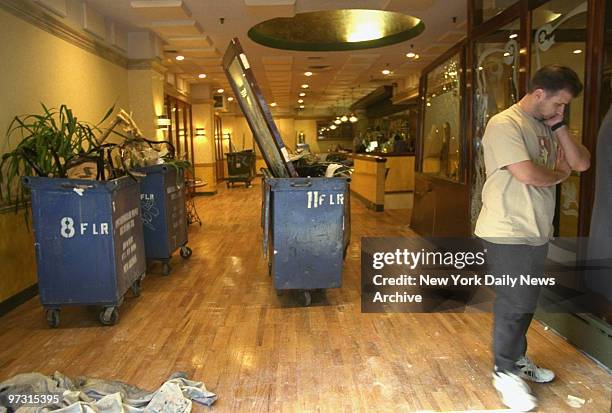 Debris is piled in dumpsters at Arno Ristorante on E. 38th St. After an out-of-control Mercedes convertible crashed through the front window and...