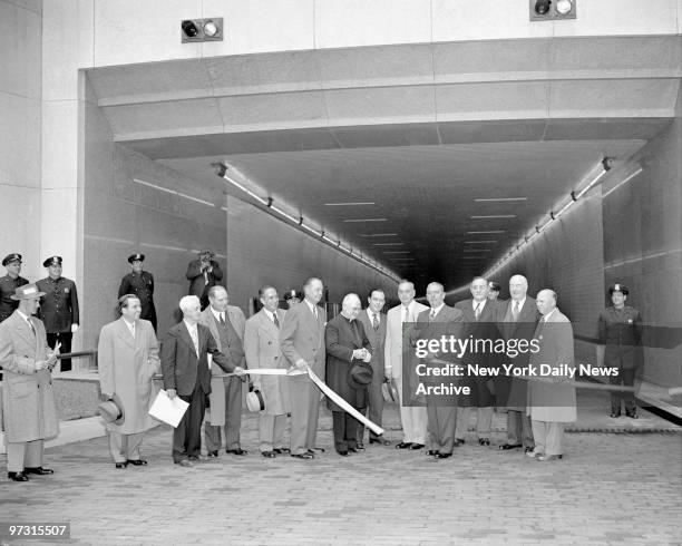 Mayor William O'Dwyer snips ribbons, officially opening Brooklyn Battery Tunnel. In photo are Pres. City Council Vincent Impellitteri, Brooklyn...