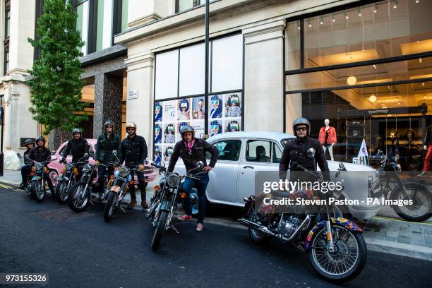 Elephant Family's 'Concours dâÃ©lÃ©phantâ made up of a customised fleet of Royal Enfield bikes, Ambassador cars and a tuk tuk parked outside...