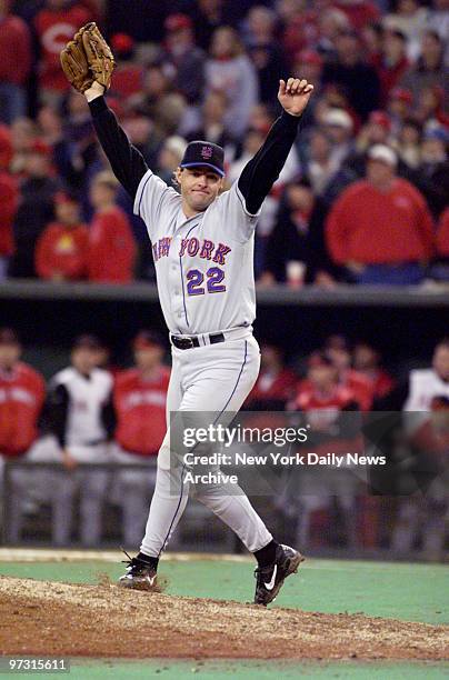 New York Mets' pitcher Al Leiter raises arms in jubilation after getting final out in single-game playoff against the Cincinnati Reds at Cinergy...