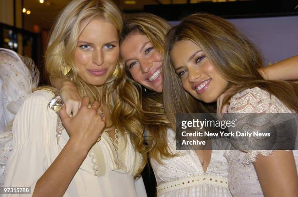 Supermodels Karolina Kurkova, Gisele Bundchen and Adriana Lima wear wings as they celebrate the Dream Angels Heavenly fragrance during a Mother's Day...