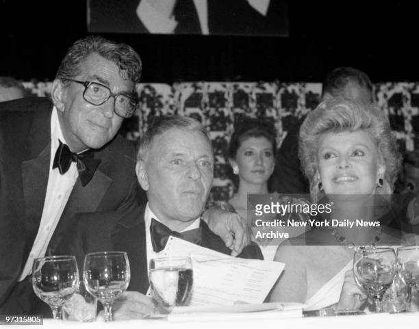 Dean Martin is honored at Friars Roast and with him is Frank Sinatra and his wife, Barbara who are enjoying the party. Sinatra skipped the...