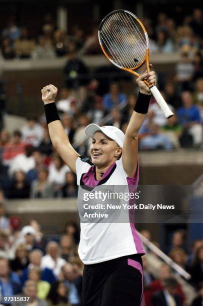 Svetlana Kuznetsova raises her fists high in triumph after defeating fellow Russian Elena Dementieva in the women's final match at Arthur Ashe...