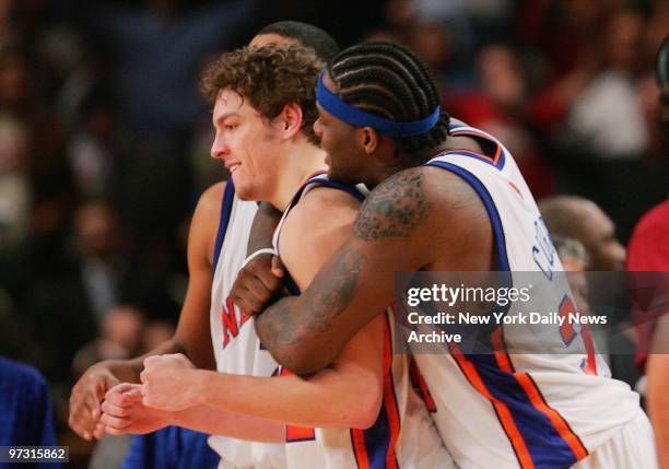 New York Knicks' Eddy Curry gives teammate David Lee a big hug after Lee tipped the ball in on a long inbounds pass at the buzzer in double overtime...