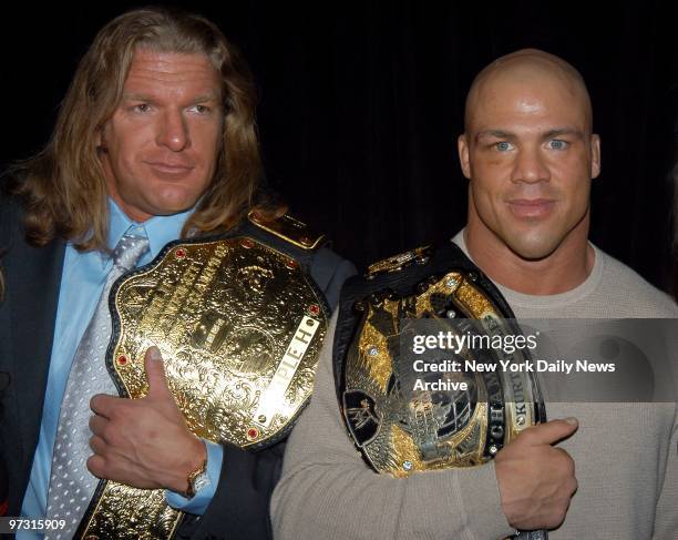 Triple H and Kurt Angle get together with their championship belts at the ESPN Zone restaurant for a WWE news confernce to announce details of...