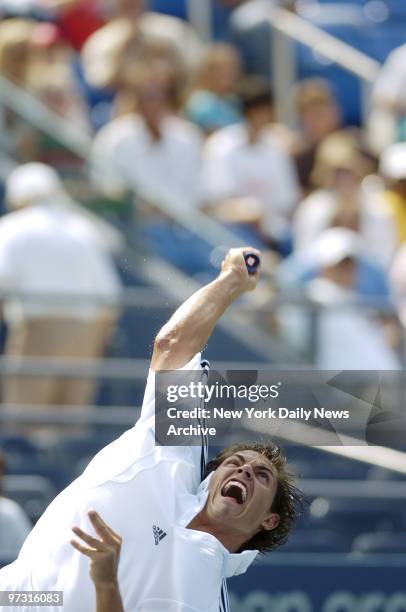 Taylor Dent of the United States serves to Lars Burgsmuller of Germany during first round play in the U.S. Open at Louis Armstrong Stadium in...