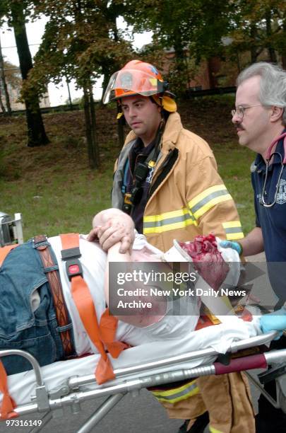 Truck driver Franklin Montes is taken by stretcher from an a, News Photo