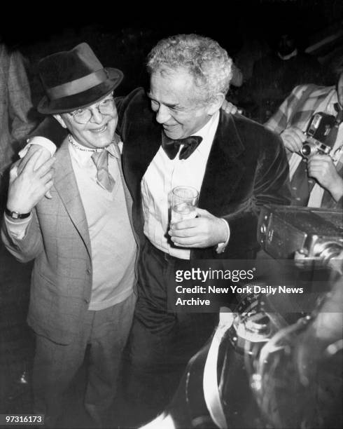 Truman Capote and Norman Mailer at a party for Dotson Rader to celebrate the arrival of Raders new book, "Miracle," from Random House.