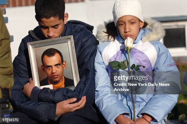 Jose Alvarado and Rafalina Fernandez mourn their uncle, Pedro Brito Rodriguez, during a memorial service this morning on the fourth anniversary of...